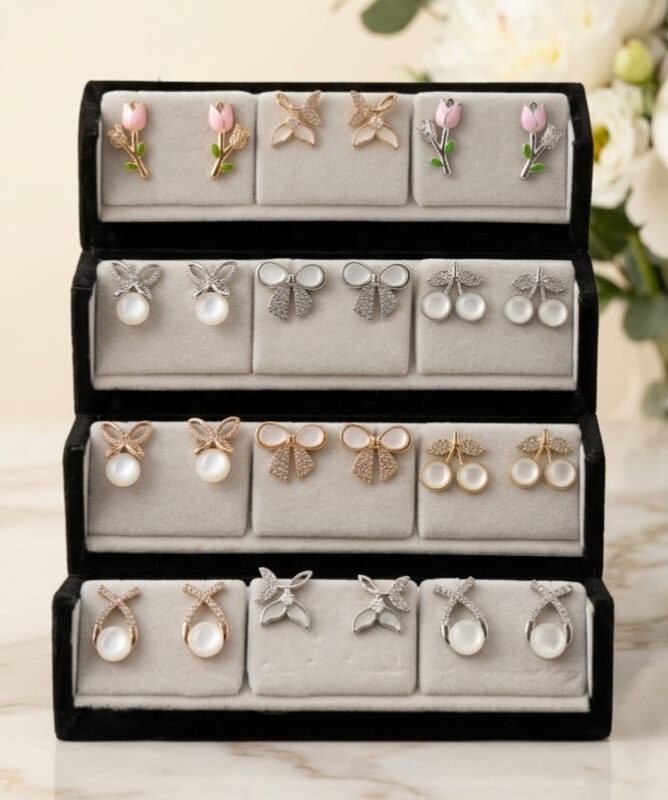 12 Pair Premium Korean Earrings Set featuring floral, butterfly, bow, cherry, and pearl stud earrings in gold and silver finishes for women and girls.